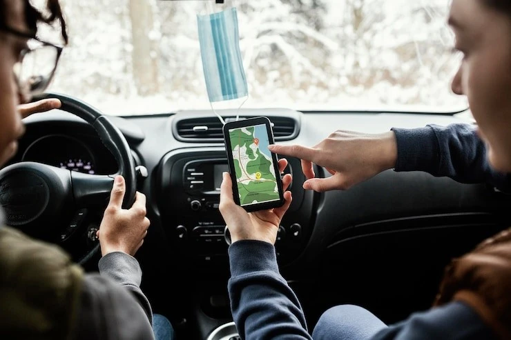 Couple of travelers using map to check their route